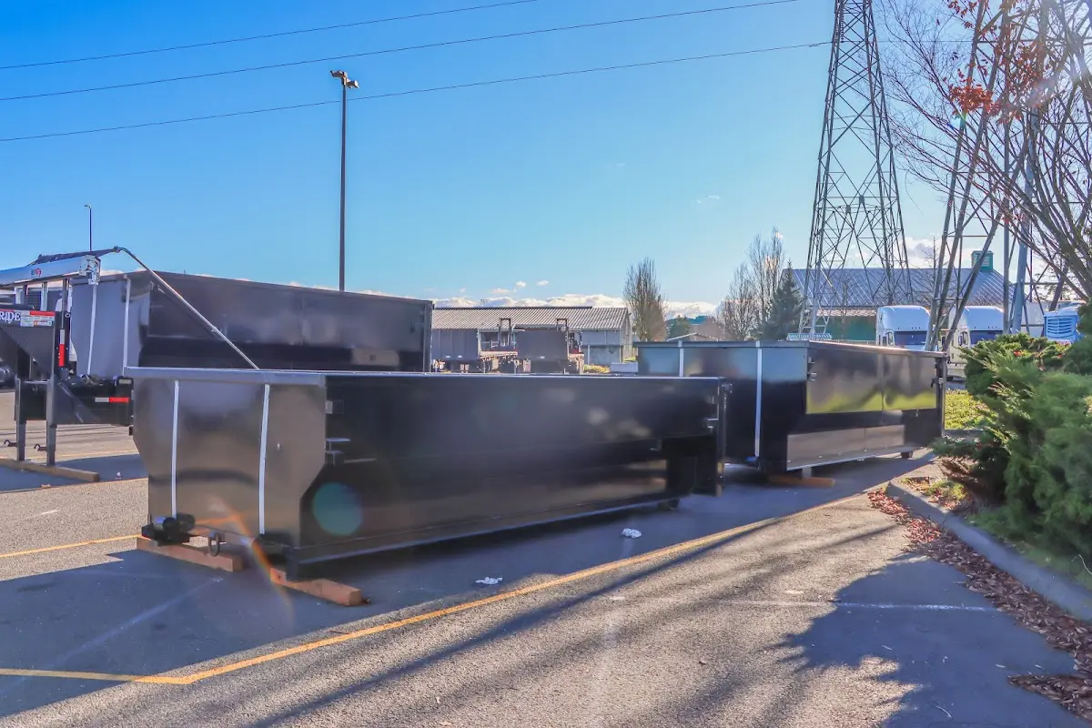 Roll-off dumpster ready for waste disposal at job site for Concrete Dumpster Rental in Tiffin